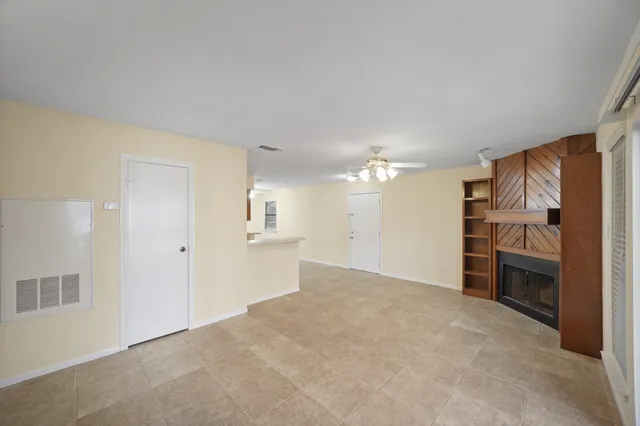 a view of a kitchen with a sink and dishwasher cabinets