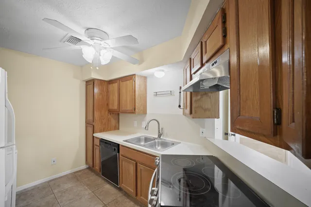 a view of a kitchen with a sink