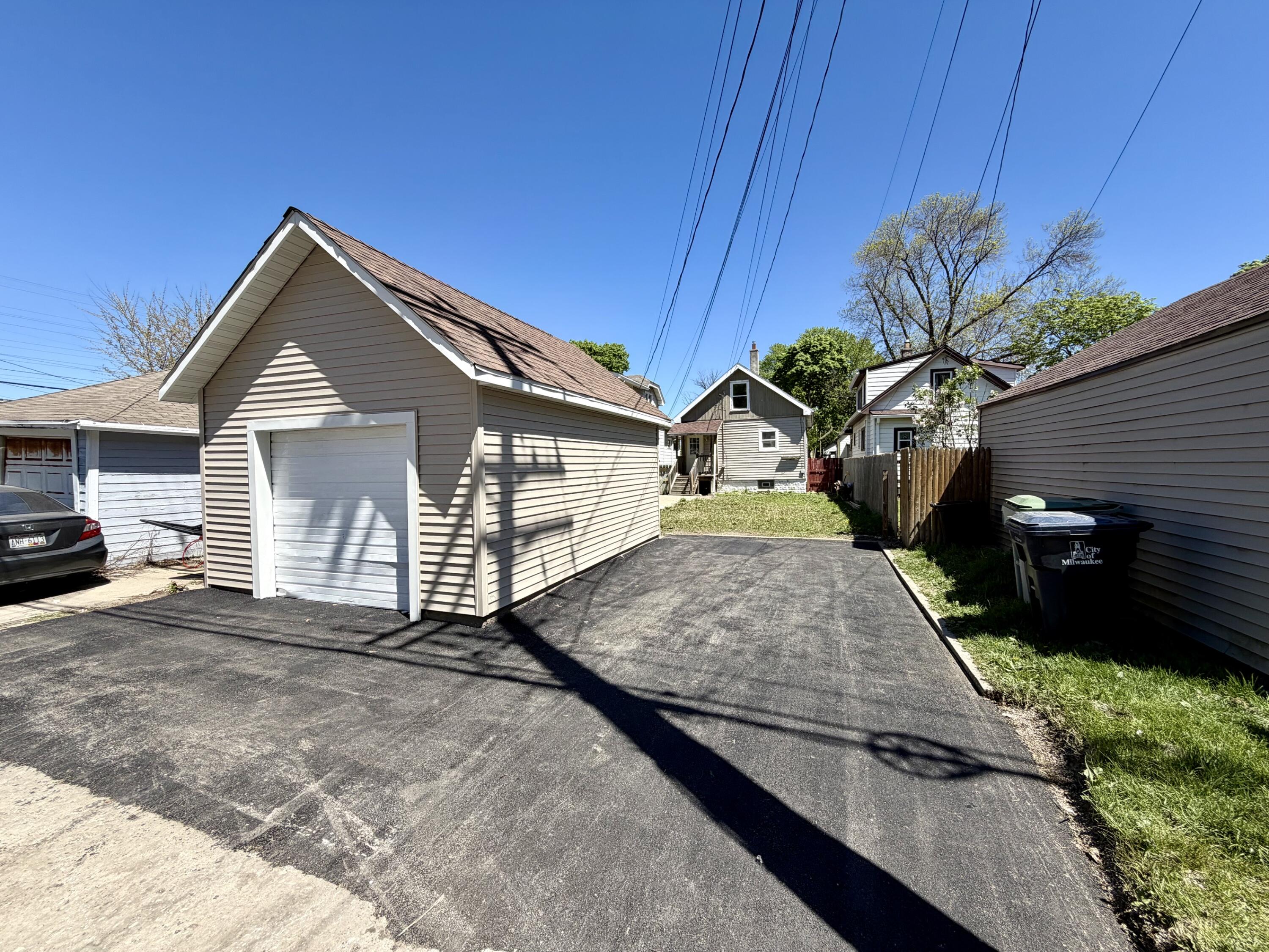 171 South 64th Street Milwaukee, WI 53214 - Photo 3 of 17 New siding and asphalt parking space