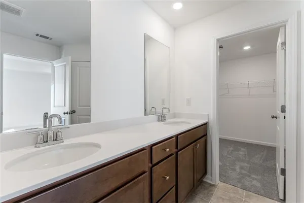 a view of an empty room and closet area