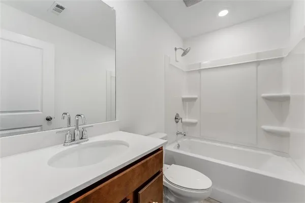 a roof deck with table and chairs potted plants
