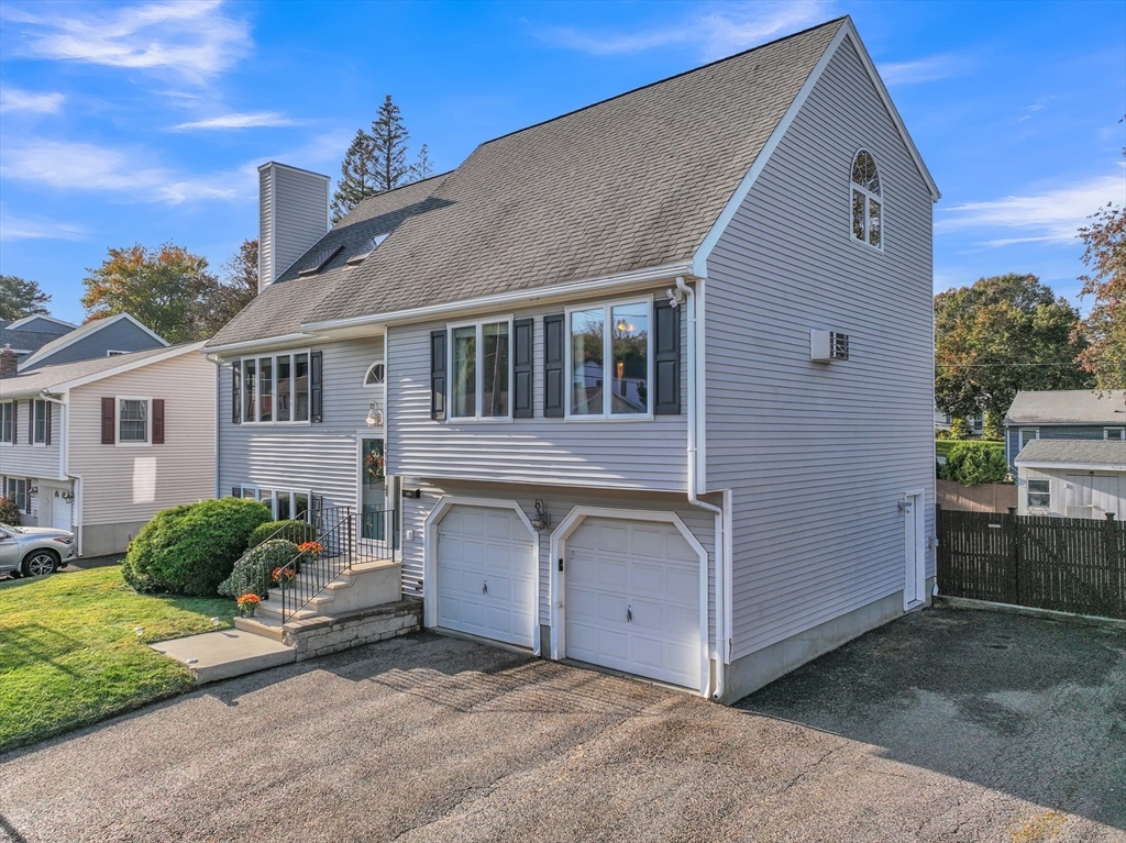 133 Derby Street Worcester, MA 01604 - Photo 2 of 42 a front view of a house with a garage