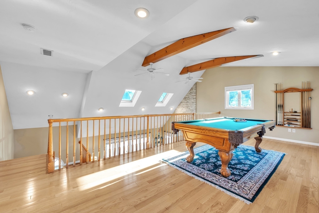 133 Derby Street Worcester, MA 01604 - Photo 21 of 42 a room with lots of wooden furniture and a rug