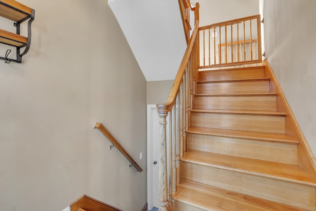 133 Derby Street Worcester, MA 01604 - Photo 27 of 42 a view of staircase with white walls and a window