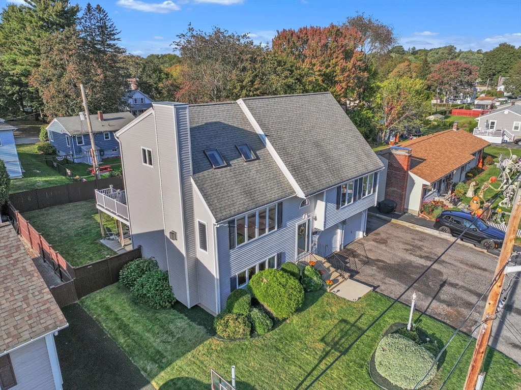 133 Derby Street Worcester, MA 01604 - Photo 3 of 42 a aerial view of a house next to a big yard and large trees