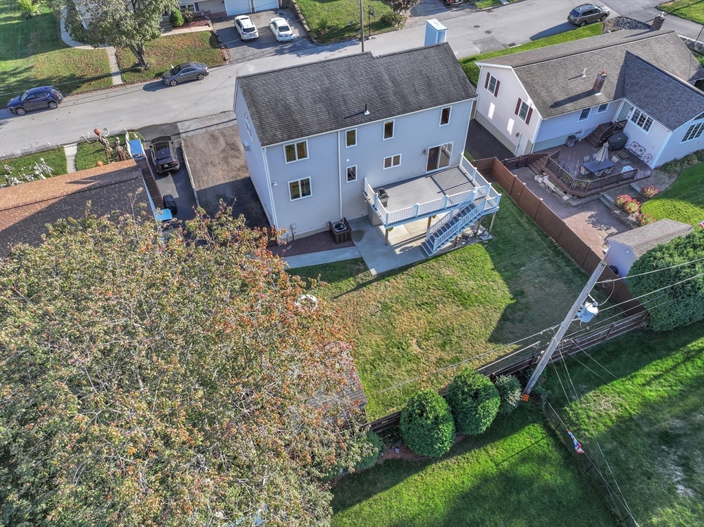 133 Derby Street Worcester, MA 01604 - Photo 41 of 42 an aerial view of a house with garden space and a patio