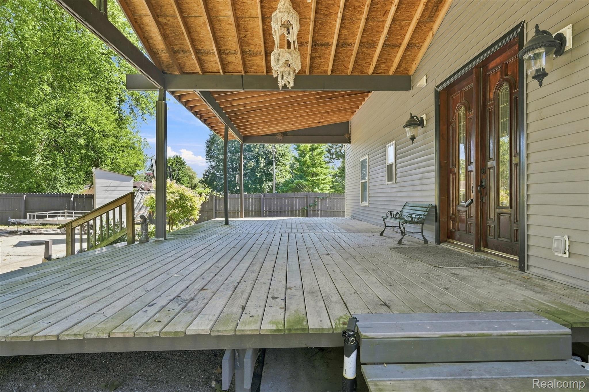 5161 Parker Road Fort Gratiot, MI 48059 - Photo 22 of 64 Expansive covered deck with wood-finish flooring