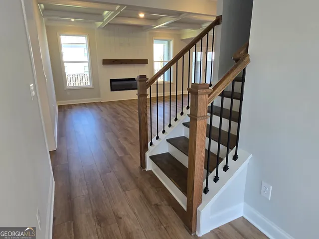 a large kitchen with kitchen island a sink stainless steel appliances and cabinets