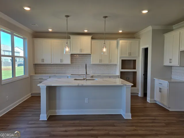 a bathroom with a bathtub and toilet