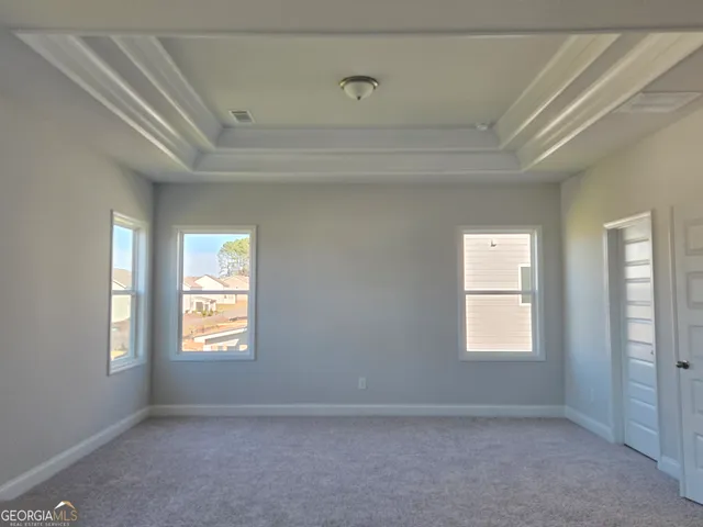 a white toilet sitting next to a bath tub