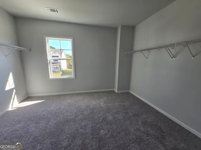 a view of house with outdoor space and seating area