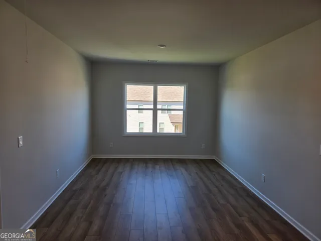 a balcony with view of the house