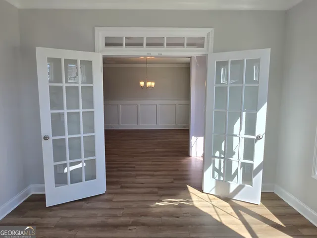 a kitchen with a refrigerator stove and wooden cabinets