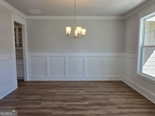 a view of kitchen with granite countertop counter space a sink appliances and cabinets