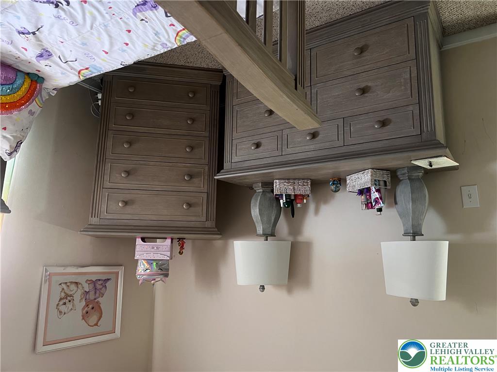 8549 Gateway Road Breinigsville, PA 18031 - Photo 26 of 26 Functional wooden dressers provide ample storage in this well-appointed living space.