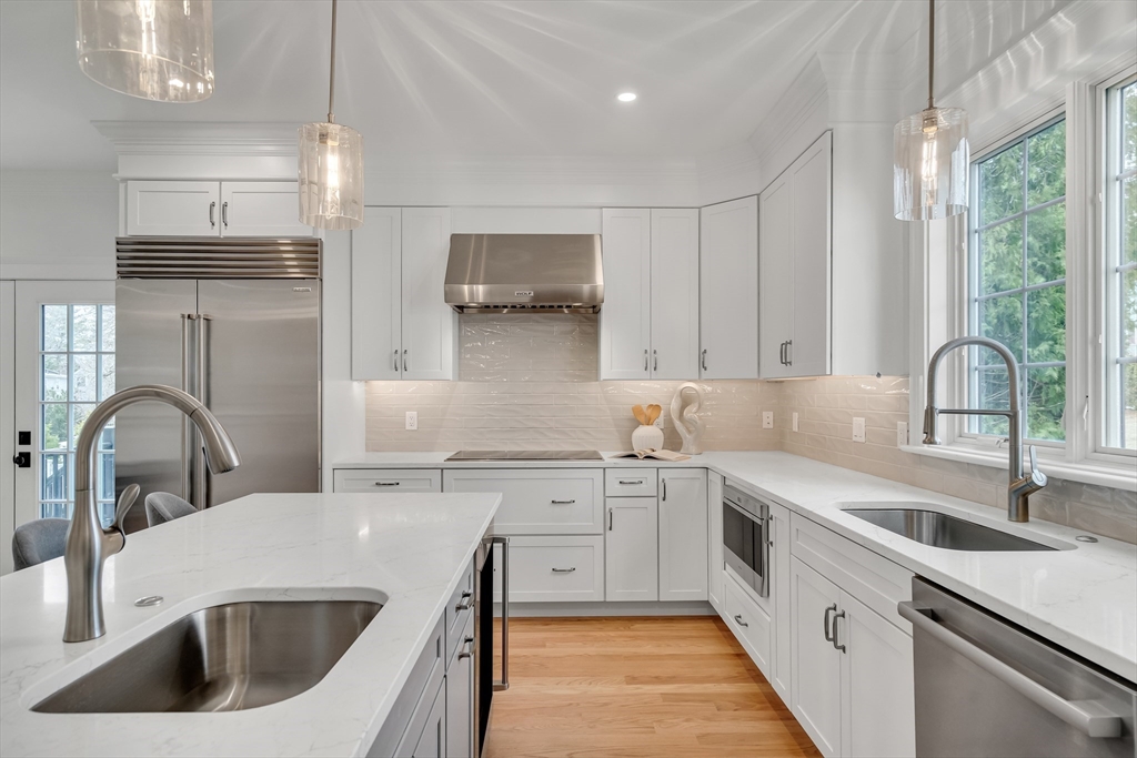 17 Hamilton Road Lexington, MA 02420 - Photo 11 of 42 a kitchen with stainless steel appliances a sink a stove and cabinets