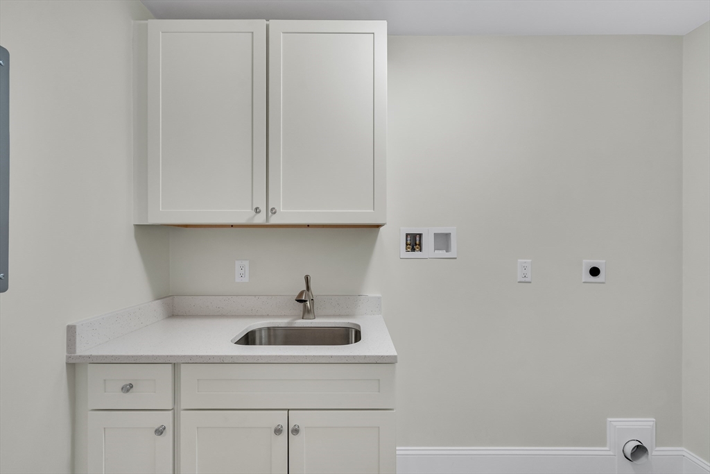 17 Hamilton Road Lexington, MA 02420 - Photo 20 of 42 a kitchen with a sink and cabinets