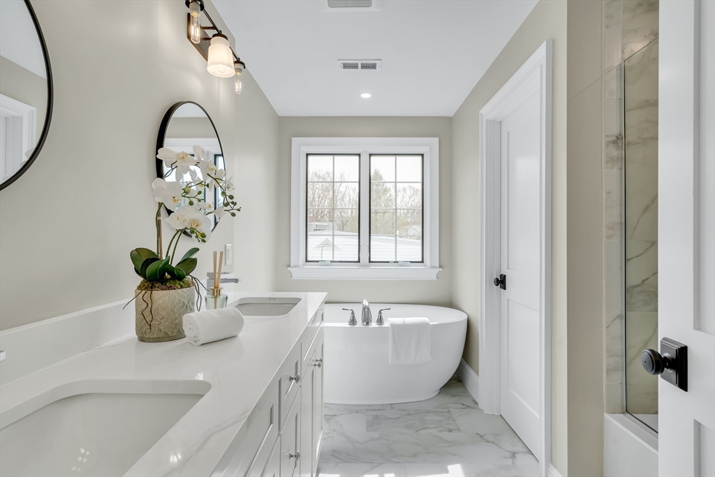 17 Hamilton Road Lexington, MA 02420 - Photo 24 of 42 a bathroom with a sink and a bathtub