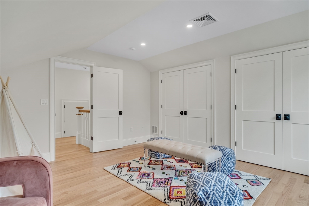 17 Hamilton Road Lexington, MA 02420 - Photo 27 of 42 a bedroom with furniture and wooden floor