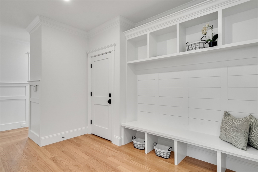 17 Hamilton Road Lexington, MA 02420 - Photo 37 of 42 a room with a wooden floor and shoes