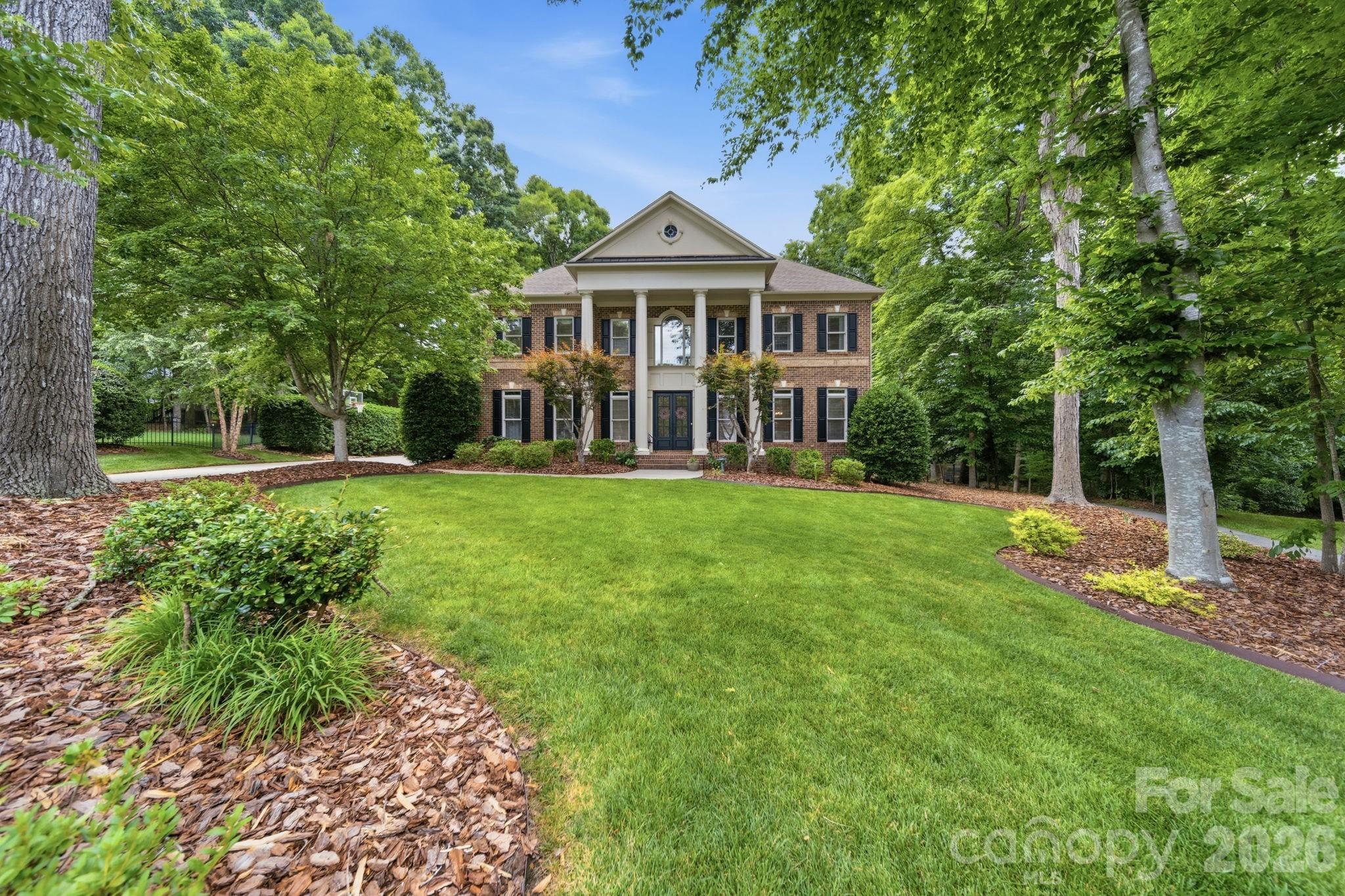 1802 Summit View Place Waxhaw, NC 28173 - Photo 1 of 47 a front view of a house with a yard