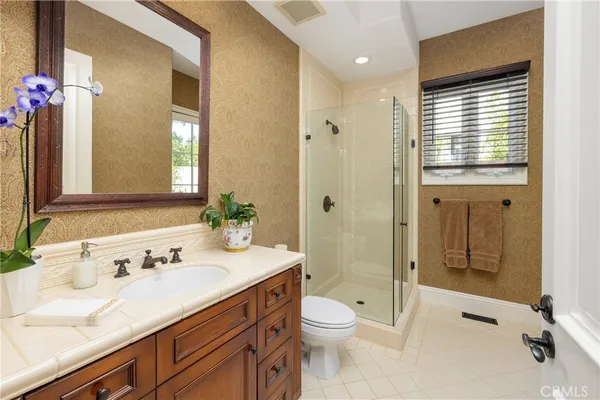 walk in closet with white cabinet
