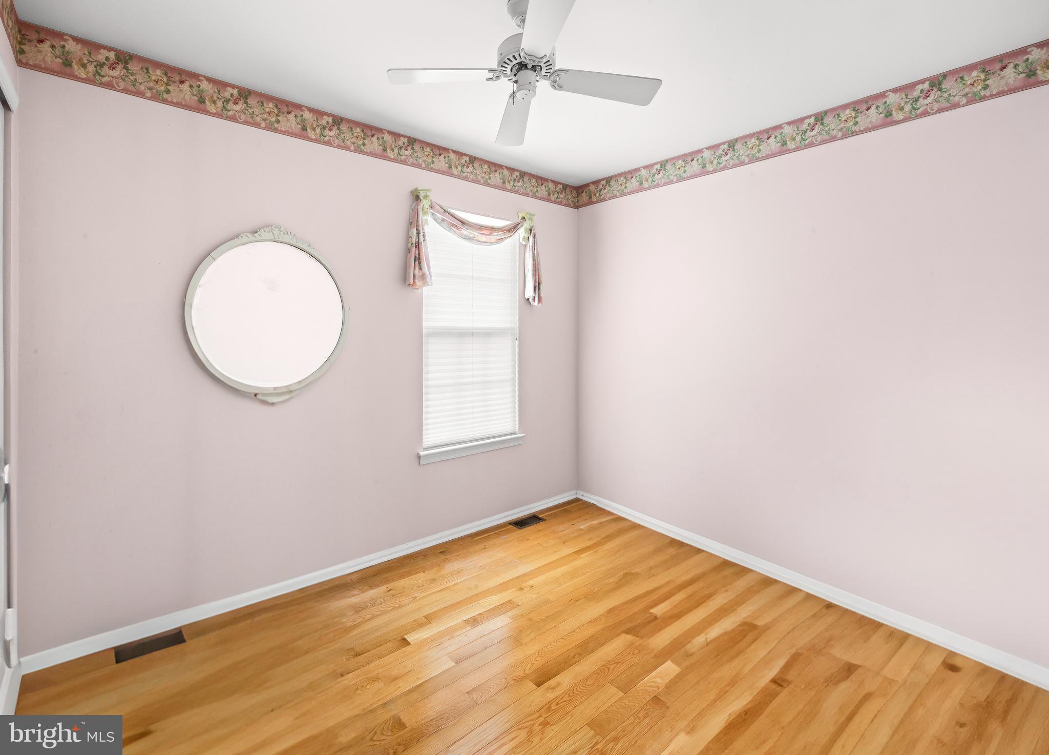 22 Trapper Road Sewell, NJ 08080 - Photo 16 of 20 a view of a room with wooden floor and fan