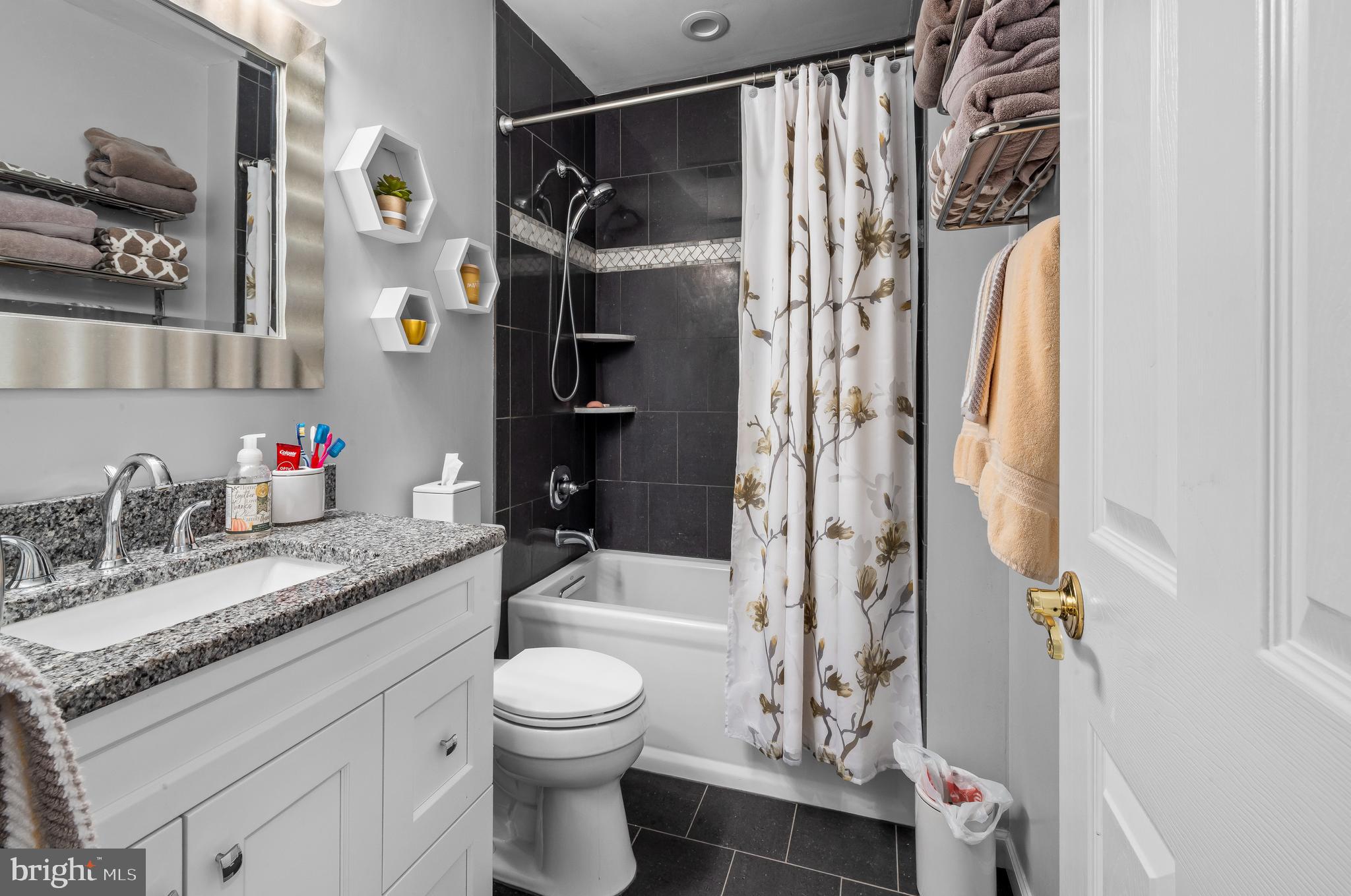 22 Trapper Road Sewell, NJ 08080 - Photo 17 of 20 a bathroom with a granite countertop sink a toilet and shower