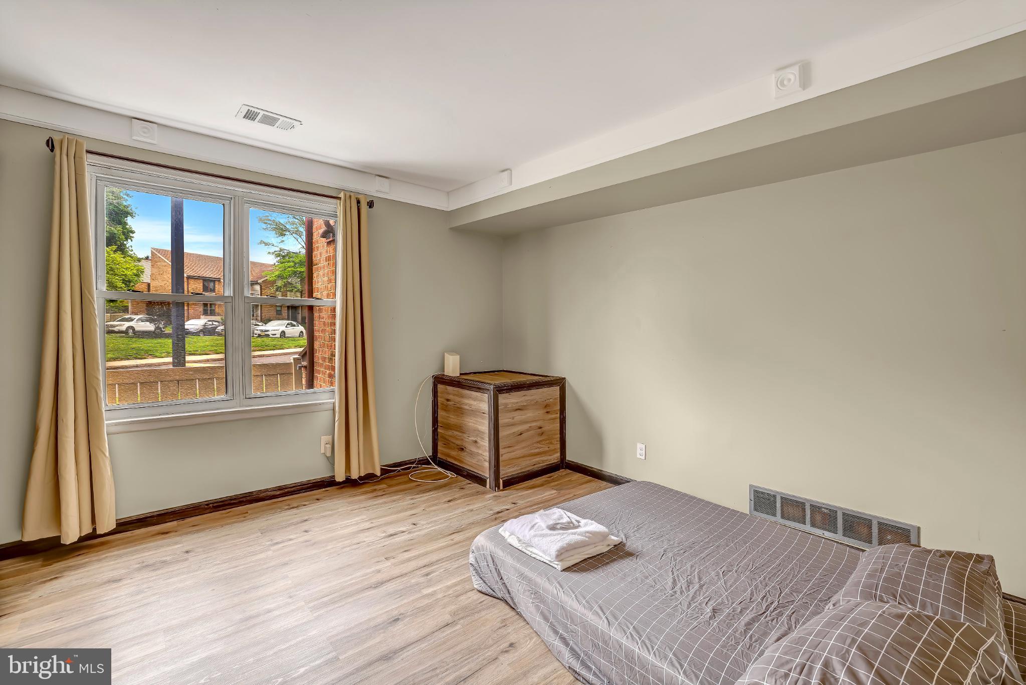 1475 Mt Holly Road, Unit O4 Beverly, NJ 08010 - Photo 15 of 18 a bedroom with a bed and wooden floor