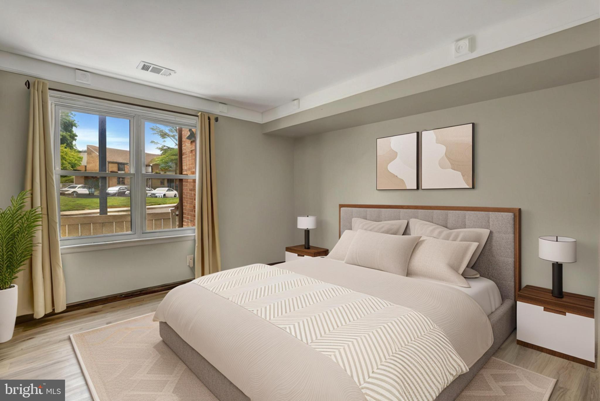 1475 Mt Holly Road, Unit O4 Beverly, NJ 08010 - Photo 16 of 18 a bedroom with a large bed and a large window