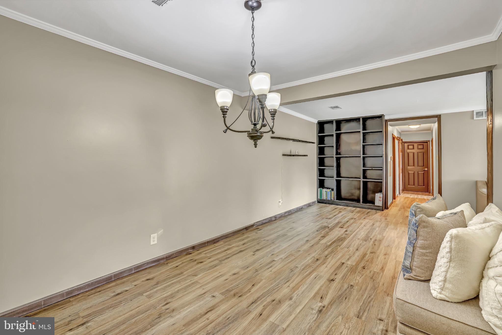 1475 Mt Holly Road, Unit O4 Beverly, NJ 08010 - Photo 7 of 18 a view of a livingroom with a chandelier fan and wooden floor