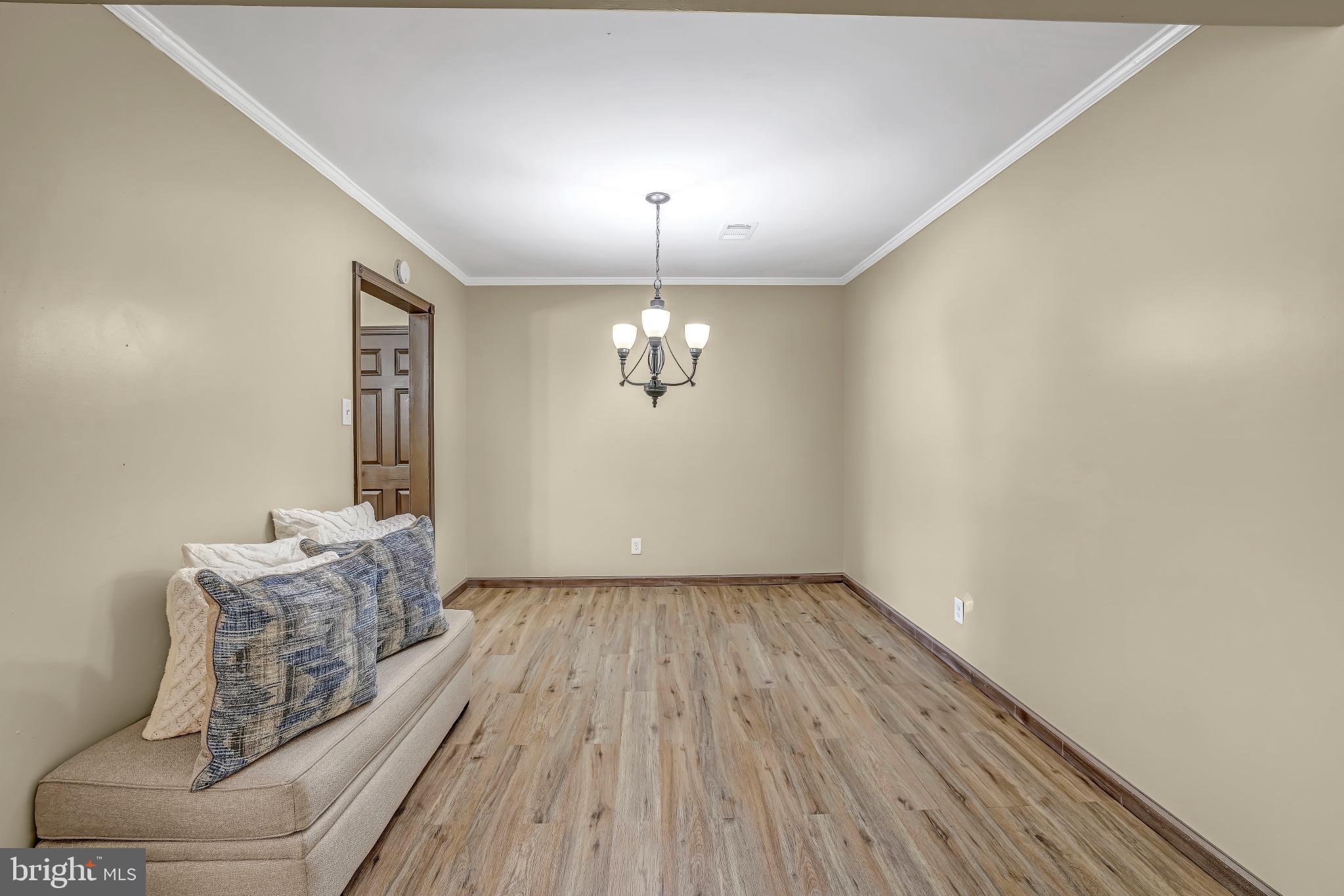 1475 Mt Holly Road, Unit O4 Beverly, NJ 08010 - Photo 8 of 18 a living room with furniture and wooden floor