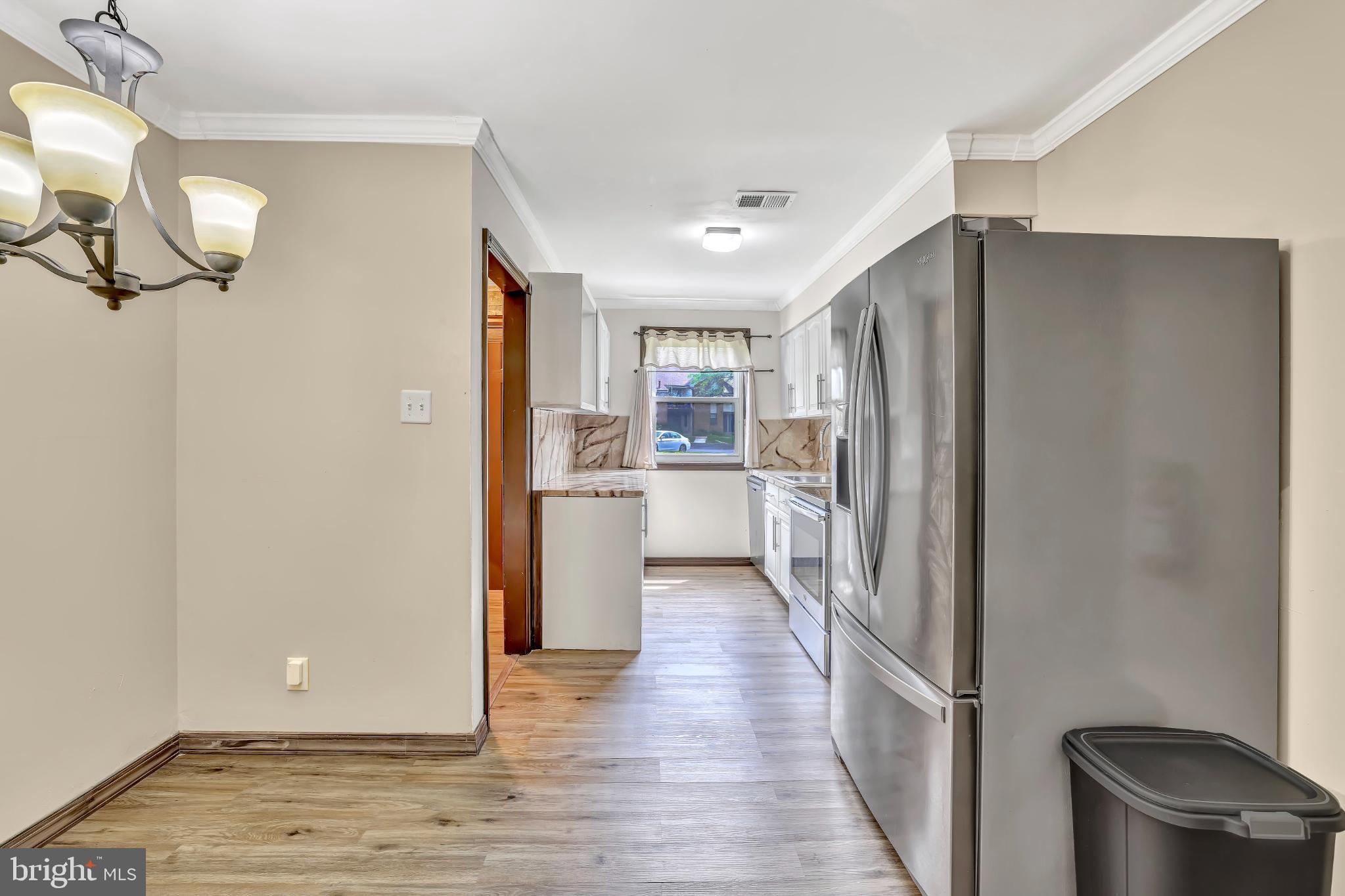 1475 Mt Holly Road, Unit O4 Beverly, NJ 08010 - Photo 9 of 18 a view of a kitchen with a refrigerator and a sink