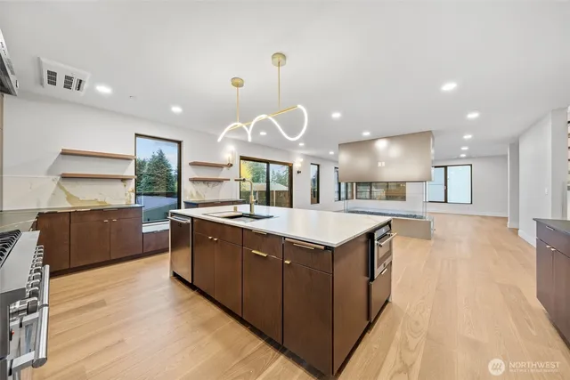 a bathroom with a granite countertop sink a toilet and a mirror