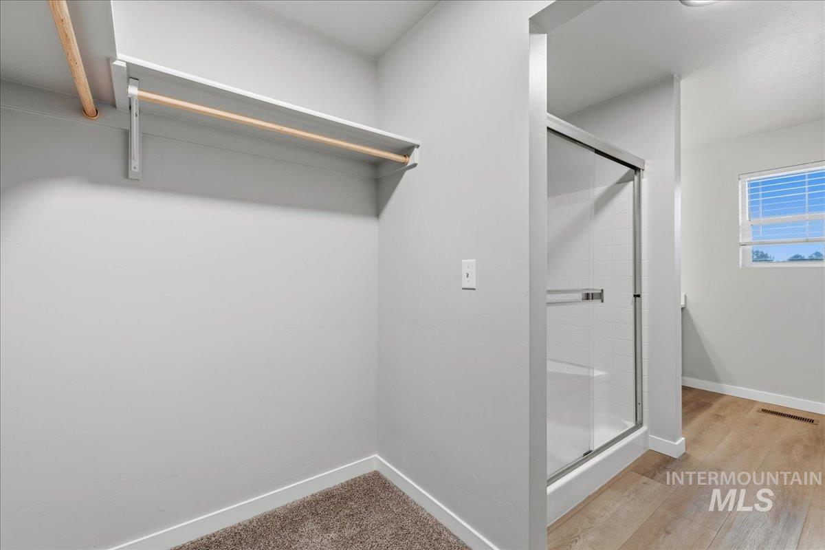 12475 West Victory Road Boise, ID 83709 - Photo 23 of 26 Walk-in closet with built-in shelving and hanging rod