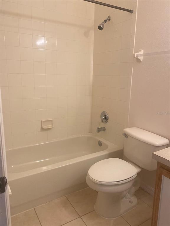 9323 Flowering Cottonwood Road Orlando, FL 32832 - Photo 17 of 23 a white toilet and tub sitting next to a bathroom sink