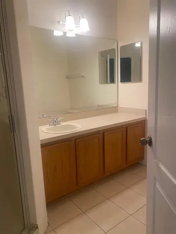 a bathroom with a sink and mirror