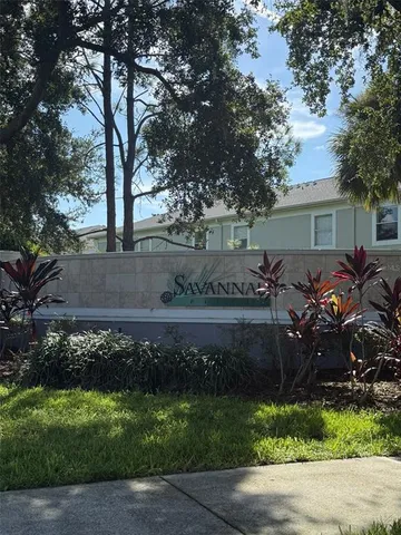 a view of garden with wooden fence