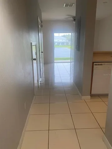 a view of empty room with windows