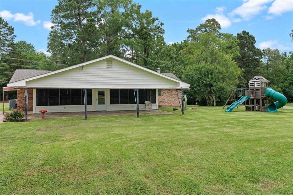 927 Stonewall-Preston Road Stonewall, LA 71078 - Photo 28 of 28 a front view of a house with a garden