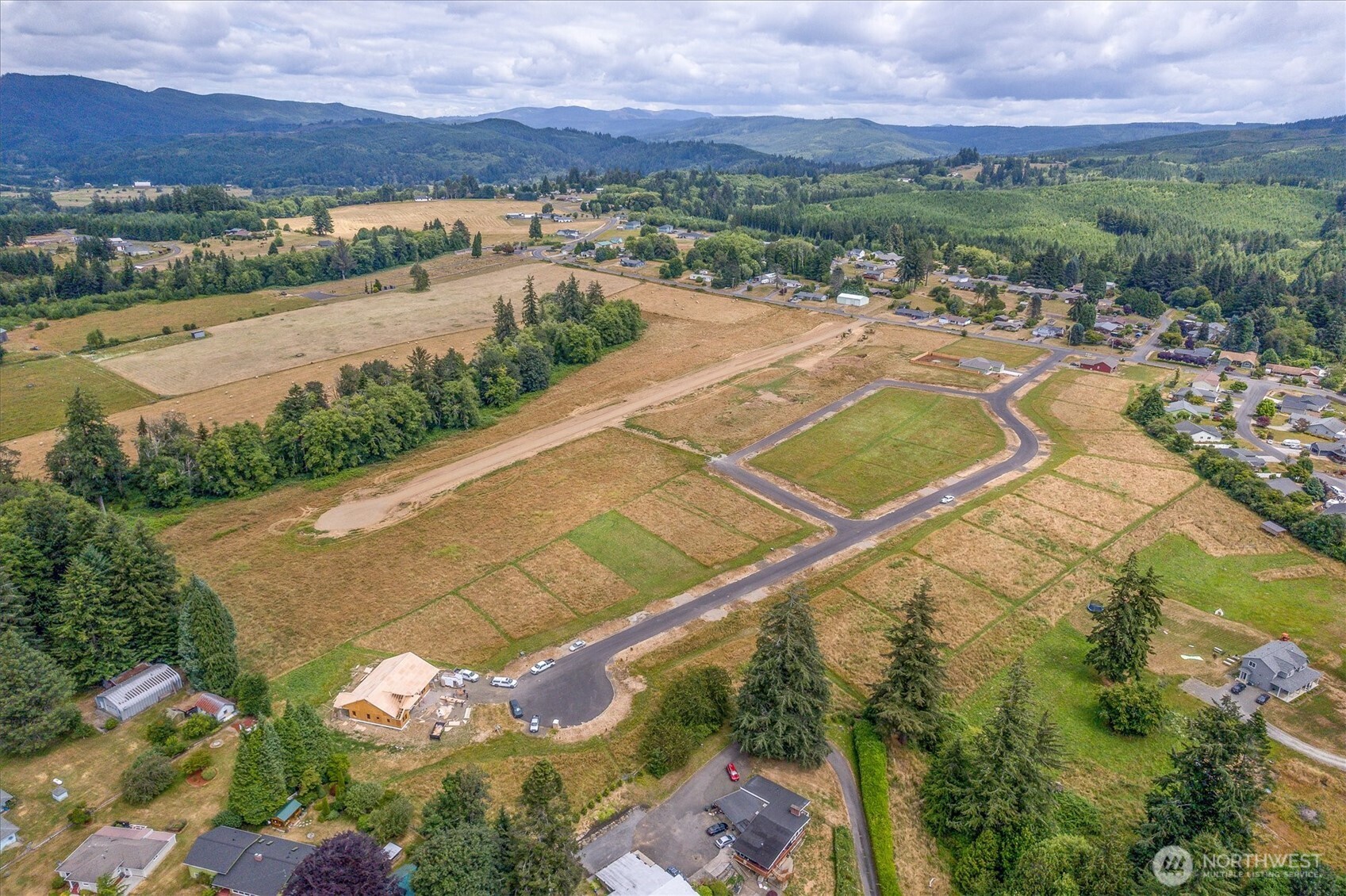 19 Anchor Way, Unit LOT 8 Cathlamet, WA 98612 - Photo 11 of 17 an aerial view of residential houses with outdoor space and river