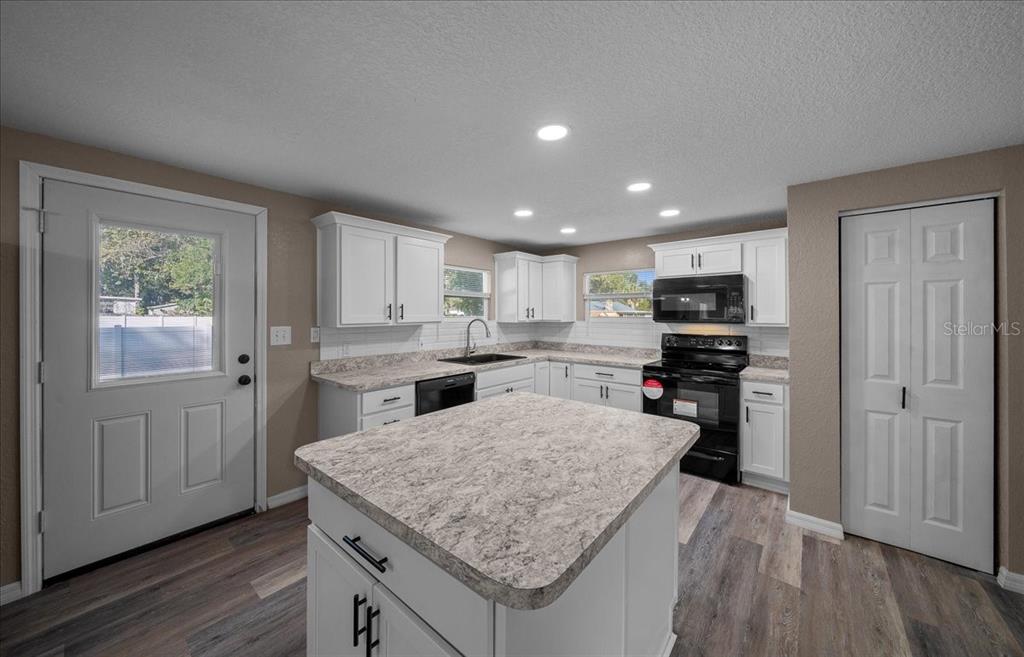 339 Southwest 83rd Street Ocala, FL 34476 - Photo 11 of 34 a kitchen with a stove a refrigerator and a sink