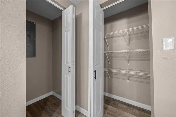 a view of walk in closet with empty racks