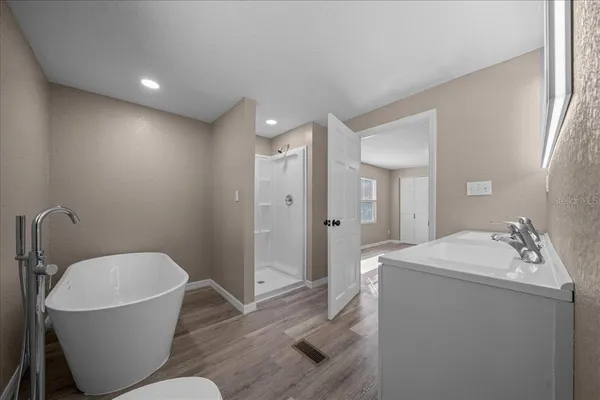 a bathroom with a sink and mirror