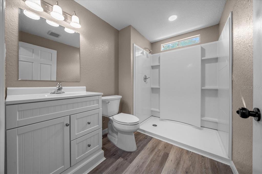 339 Southwest 83rd Street Ocala, FL 34476 - Photo 26 of 34 a bathroom with a sink a toilet and shower