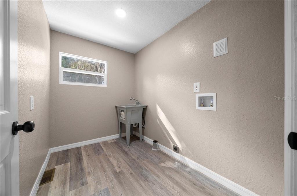 339 Southwest 83rd Street Ocala, FL 34476 - Photo 27 of 34 a view of a room with wooden floor and a window