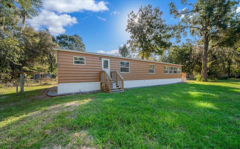 339 Southwest 83rd Street Ocala, FL 34476 - Photo 29 of 34 a view of a backyard with a garden