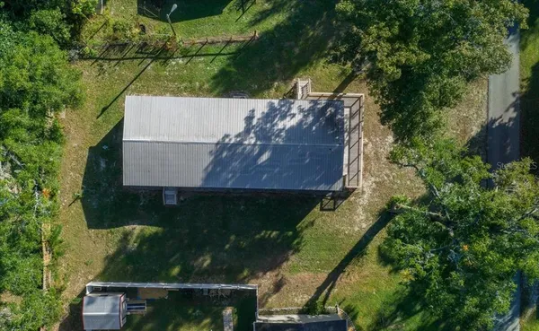 an aerial view of house with yard