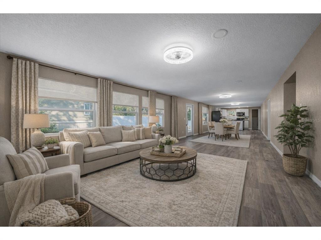 339 Southwest 83rd Street Ocala, FL 34476 - Photo 7 of 34 a living room with furniture and a large window