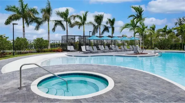 a view of a swimming pool with a yard